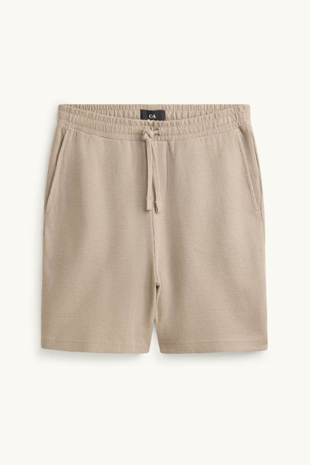 Hommes - Short en molleton - finition texturée - beige
