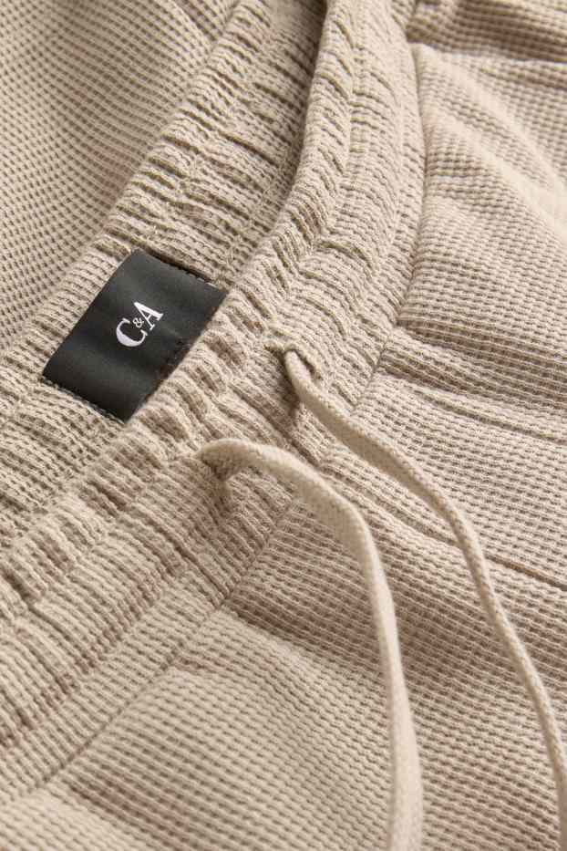 Hommes - Short en molleton - finition texturée - beige