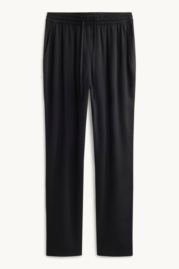 Dona - Pantalons de tela - mid waist - tapered fit - negre