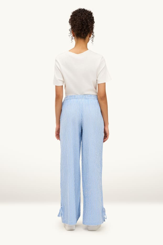 Dámské - Mušelínové plátěné kalhoty - mid waist - wide leg - pruhované - světle modrá