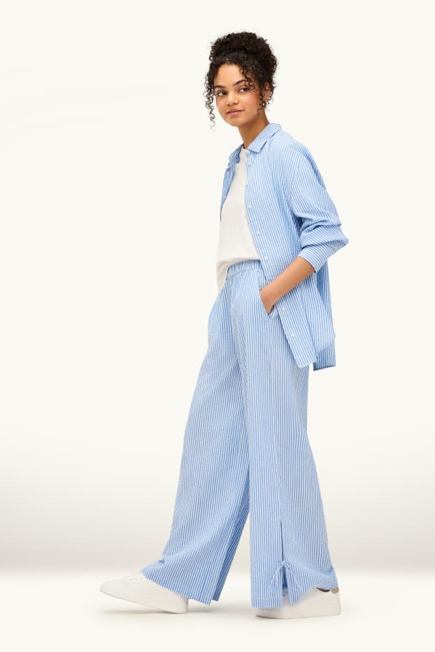 Dámské - Mušelínové plátěné kalhoty - mid waist - wide leg - pruhované - světle modrá