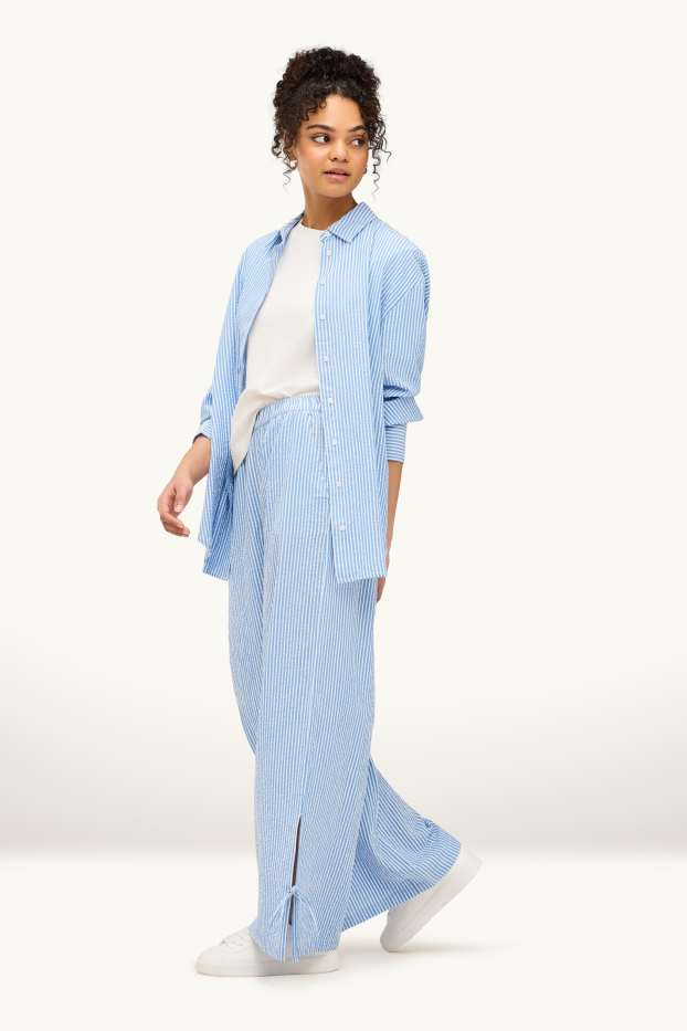 Dámské - Mušelínové plátěné kalhoty - mid waist - wide leg - pruhované - světle modrá