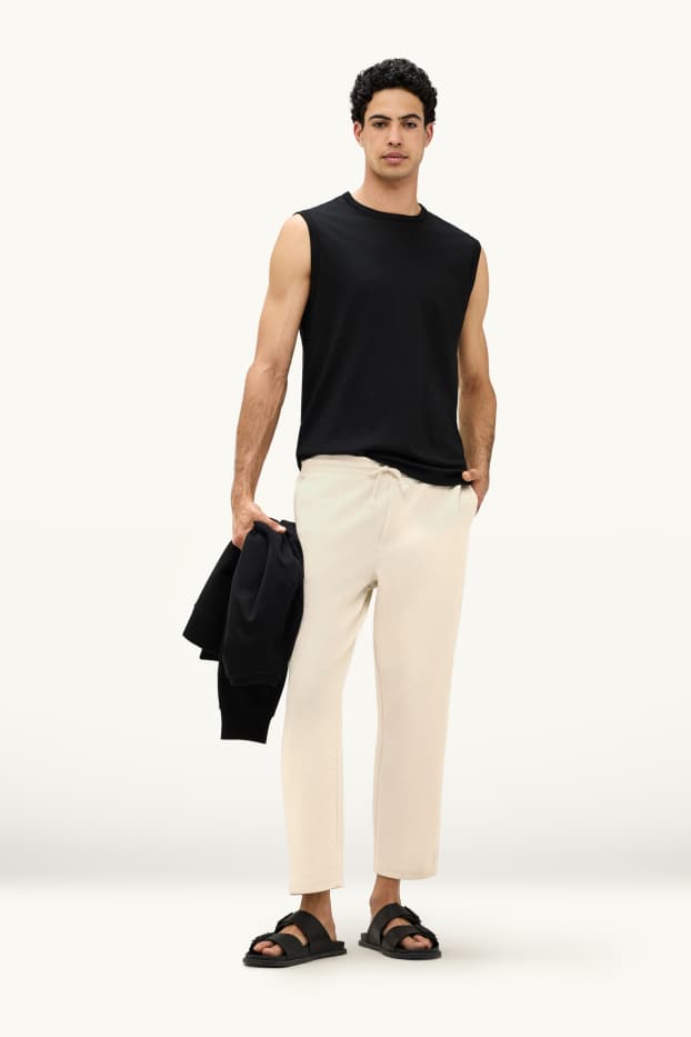 Mężczyźni - Spodnie dresowe - kremowy