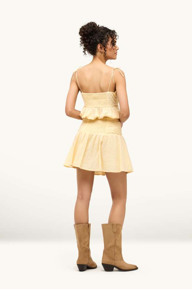 Femmes - Minijupe - finition texturée - jaune clair