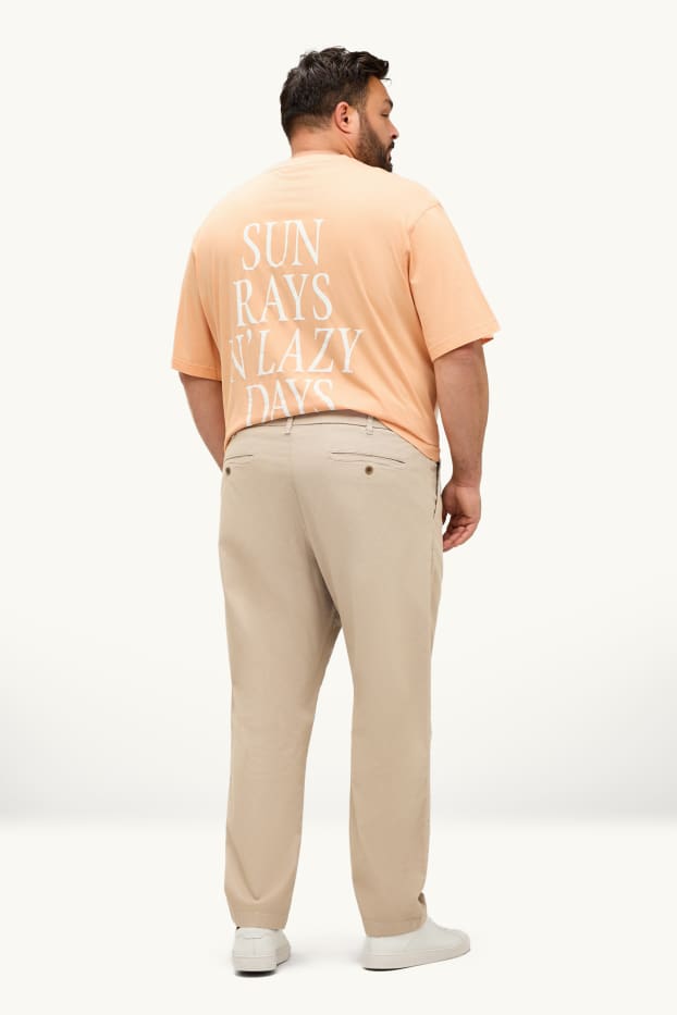 Hommes - Chino - tapered fit - finition texturée - beige clair