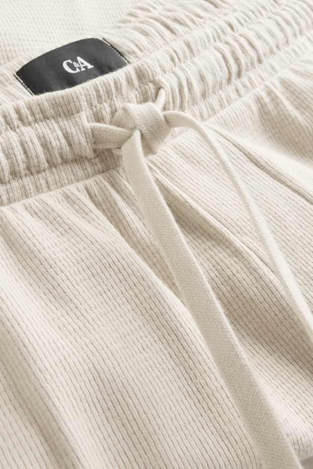 Uomo - Shorts in felpa - tessuto tramato - bianco crema