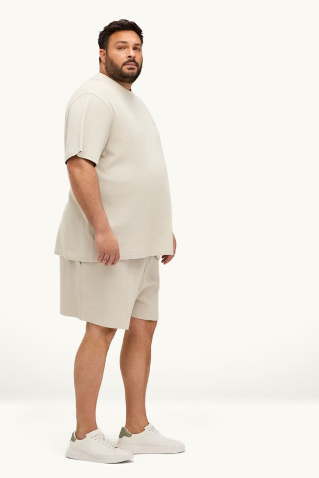 Uomo - Shorts in felpa - tessuto tramato - bianco crema