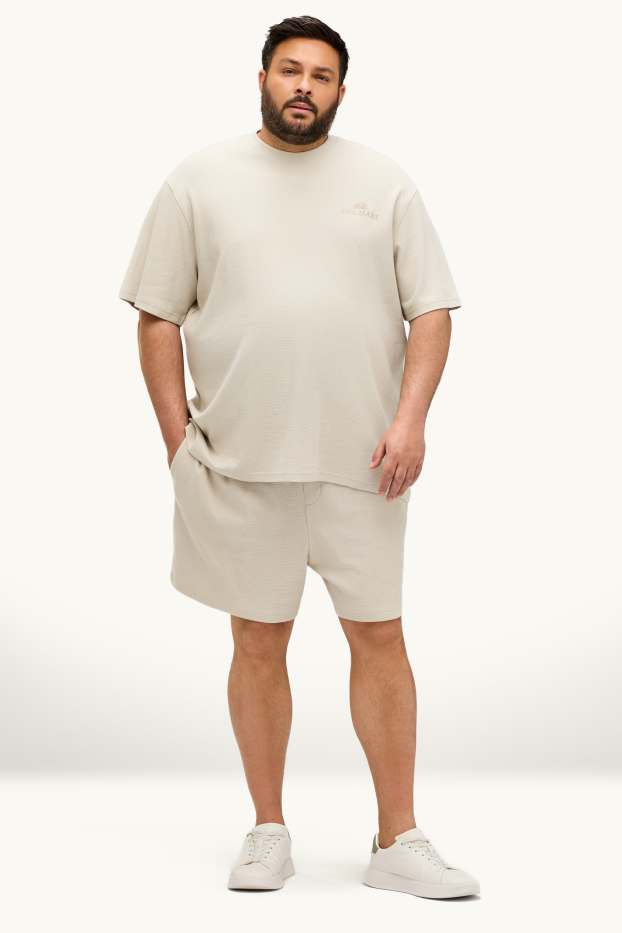 Uomo - Shorts in felpa - tessuto tramato - bianco crema