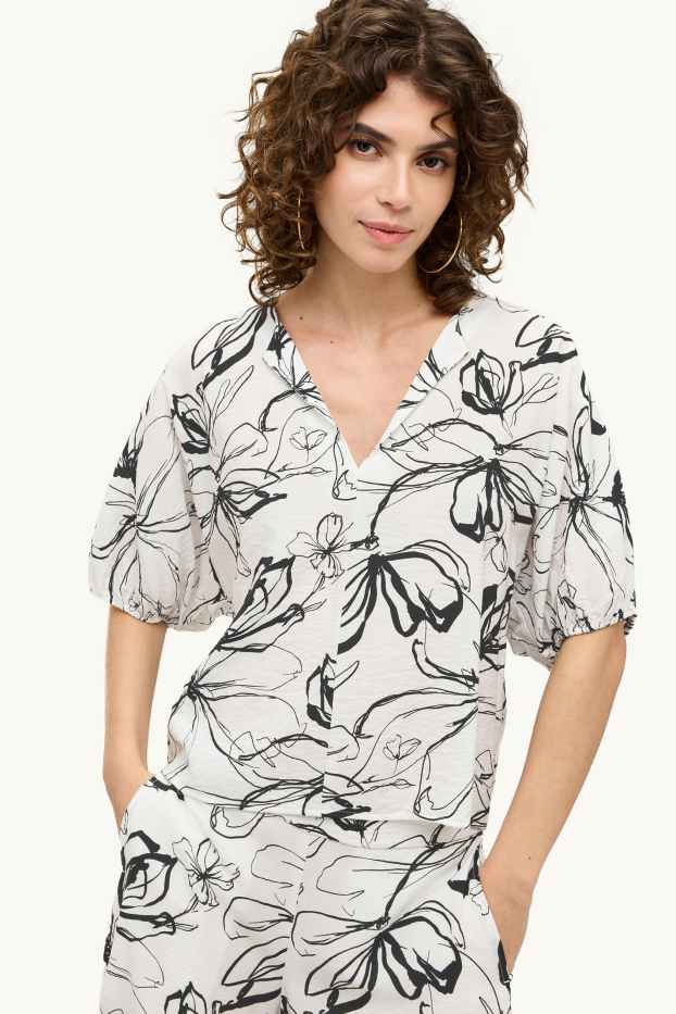 Dames - Blouse met V-hals - gebloemd - wit / zwart