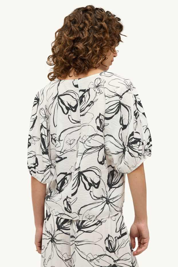 Dames - Blouse met V-hals - gebloemd - wit / zwart