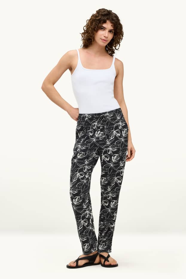 Donna - Pantaloni - vita media - tapered fit - a fiori - bianco / nero