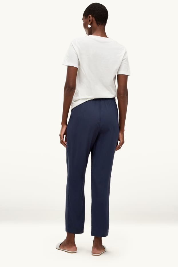 Dona - Pantalons de tela - mid waist - tapered fit - blau fosc