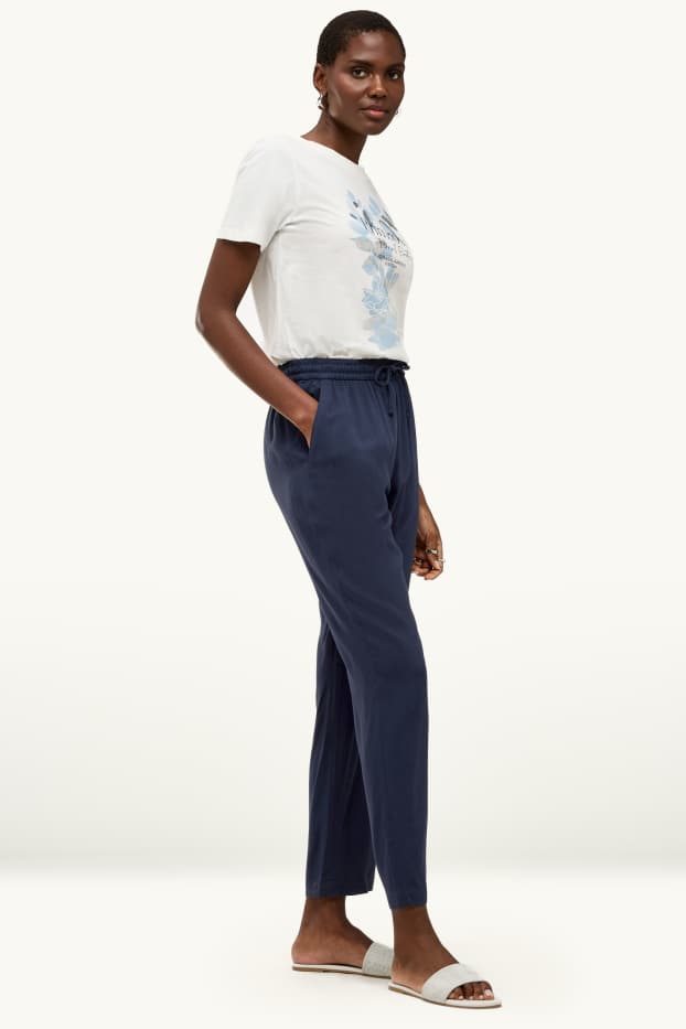Dona - Pantalons de tela - mid waist - tapered fit - blau fosc