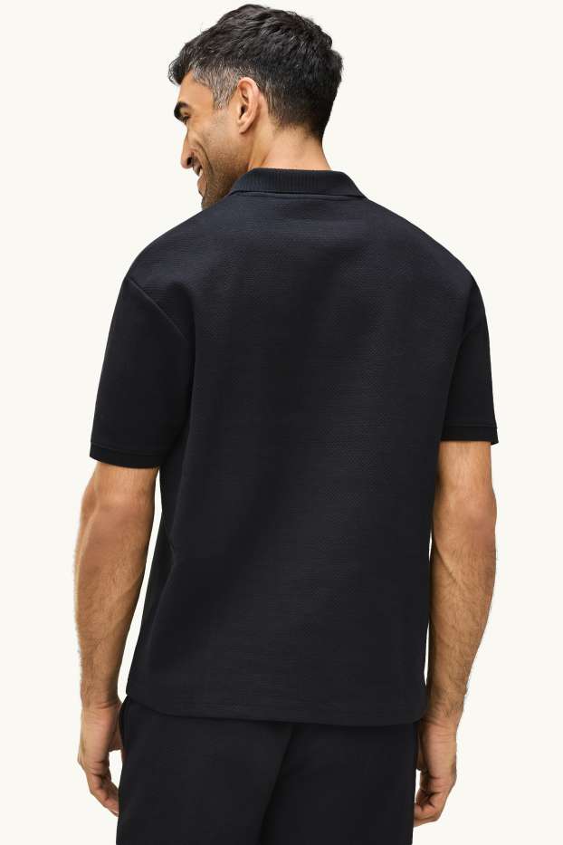 Hommes - Polo - relaxed fit - finition texturée - noir