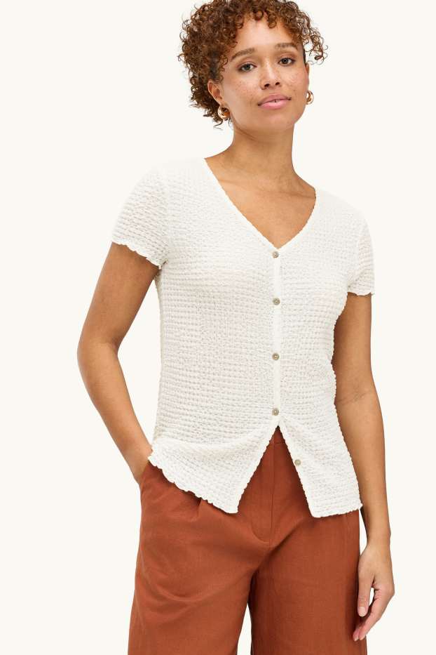 Dames - T-shirt met V-hals en knoopsluiting - regular fit - crèmekleurig