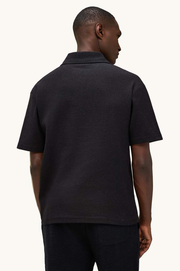 Heren - Gebreid poloshirt - relaxed fit - zwart