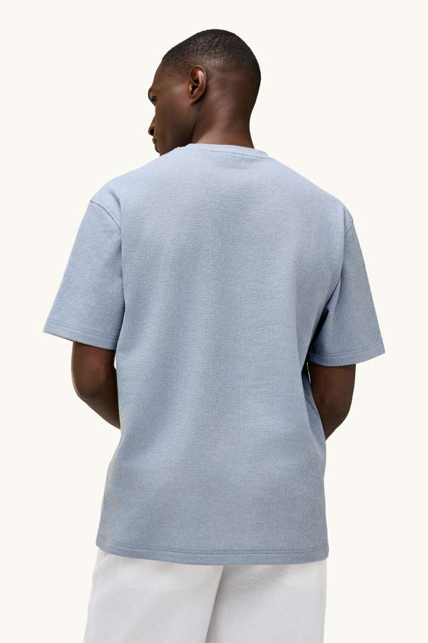 Mężczyźni - T-shirt - relaxed fit - niebieski