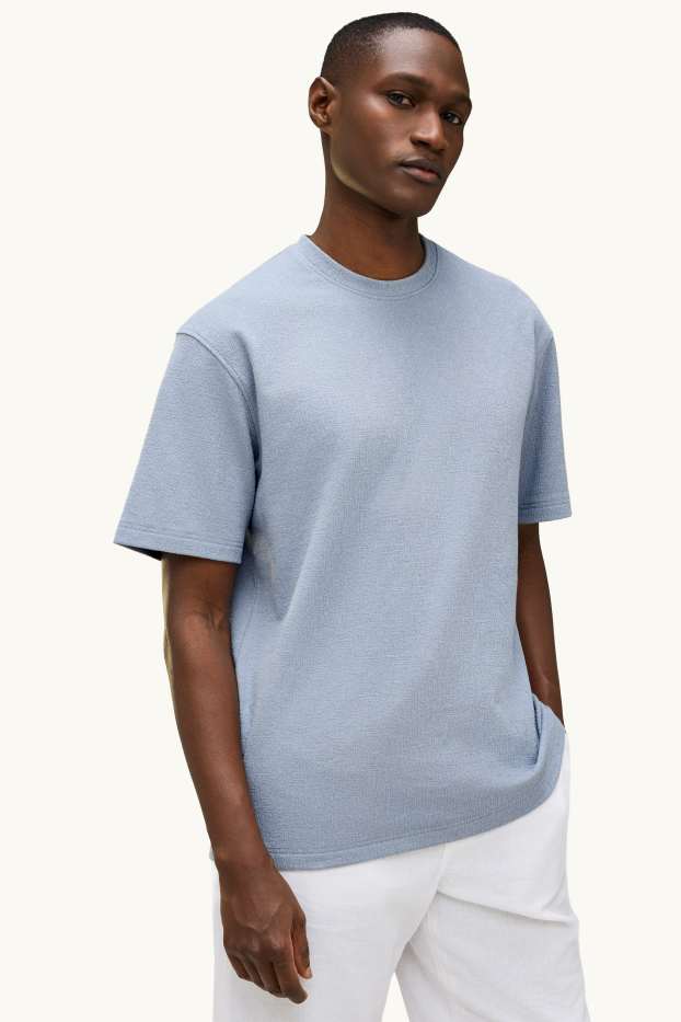 Mężczyźni - T-shirt - relaxed fit - niebieski