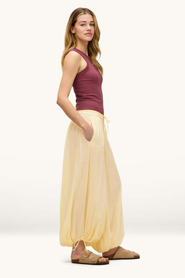 Dona - Pantalons orientals - mid waist - camal balloon - groc