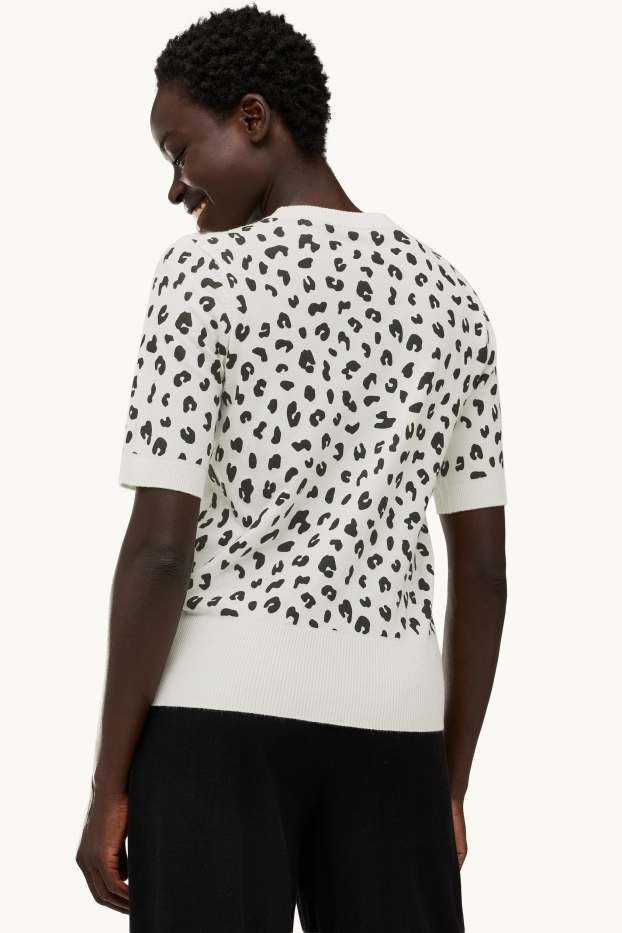 Femmes - Pull de maille - manches courtes - imprimé léopard - blanc / noir