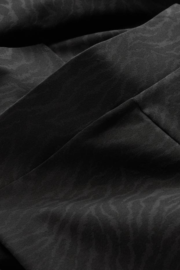 Dona - Leggings straight - estampat - negre