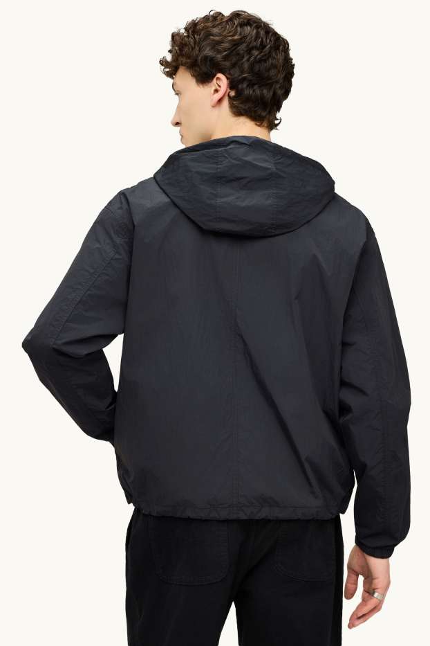 Uomo - Giacca impermeabile con cappuccio - idrorepellente - nero