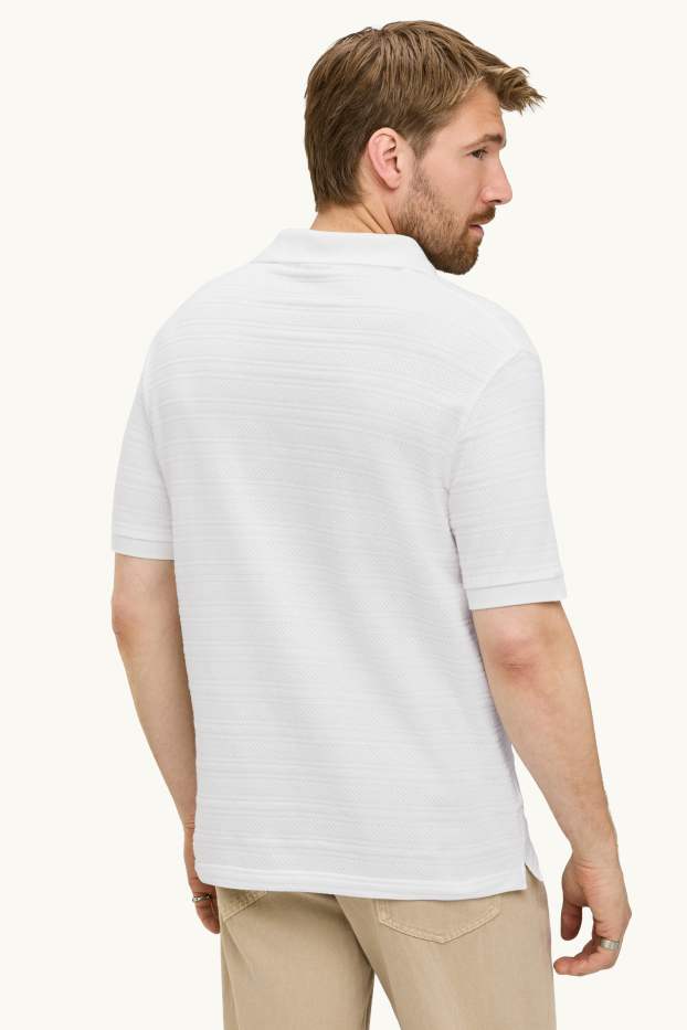 Home - Polo de punt de mitja - regular fit - texturat - de ratlles - blanc