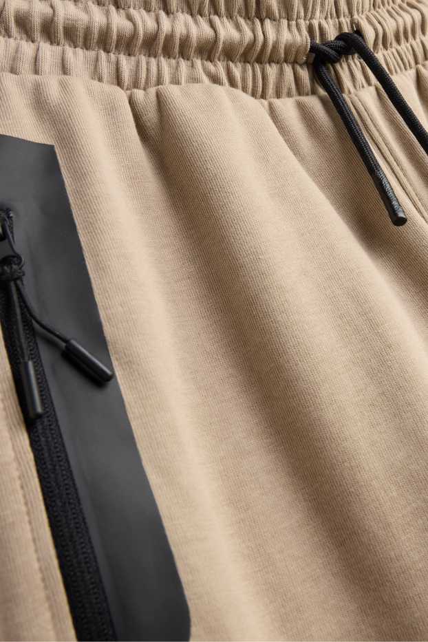 Kinder Buben - Jogginghose - schwarz / beige