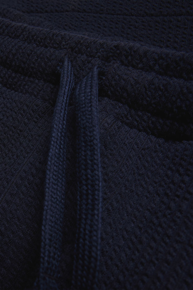 Men - Sweat shorts - textured - dark blue