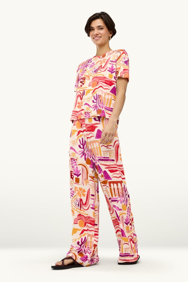 Dames - Pantalon - mid waist - palazzo - met patroon - oranje
