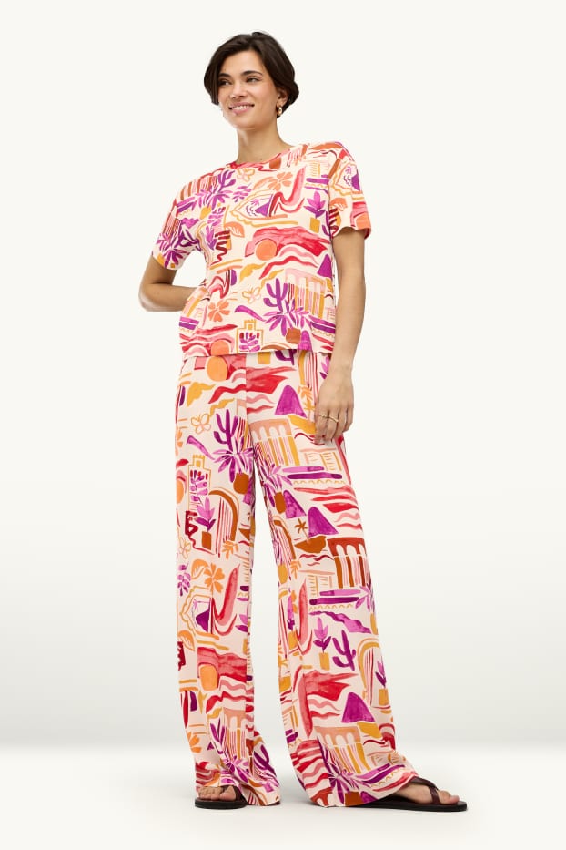 Dames - Pantalon - mid waist - palazzo - met patroon - oranje