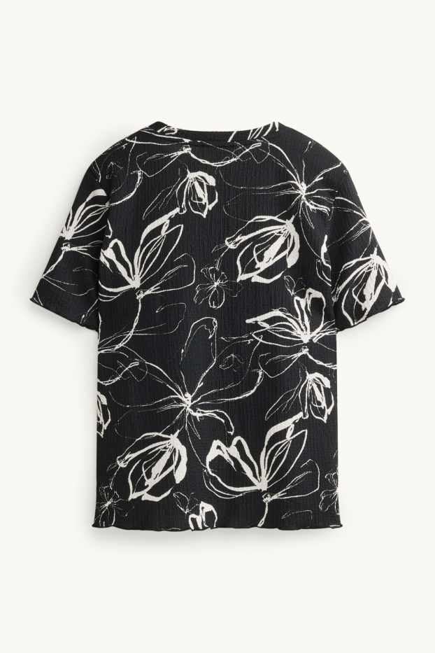 Dames - T-shirt - regular fit - gebloemd - zwart / wit