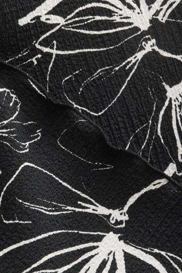 Dames - T-shirt - regular fit - gebloemd - zwart / wit