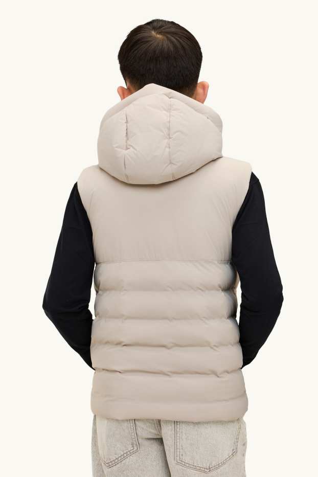 Kinderen: jongens - Bodywarmer met capuchon - waterafstotend - beige