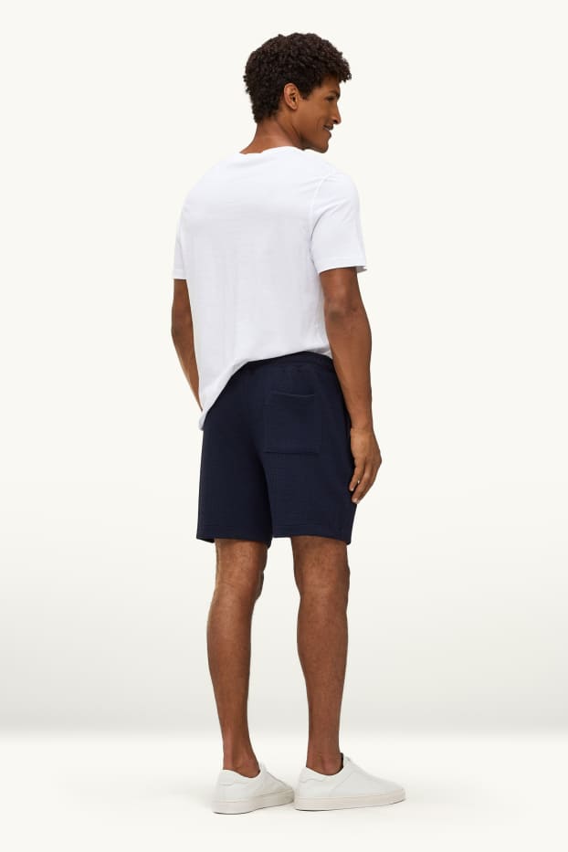 Hommes - Short en molleton - finition texturée - bleu foncé