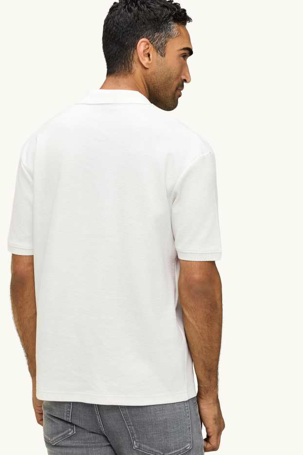 Uomo - Polo - relaxed fit - tessuto tramato - bianco