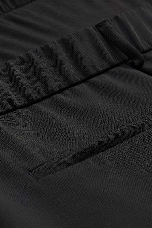 Femmes - Pantalon de grossesse - jambes larges - noir