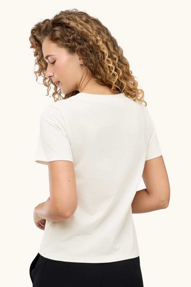 Dona - Samarreta de mànigues curtes amb perles - regular fit - blanc/negre