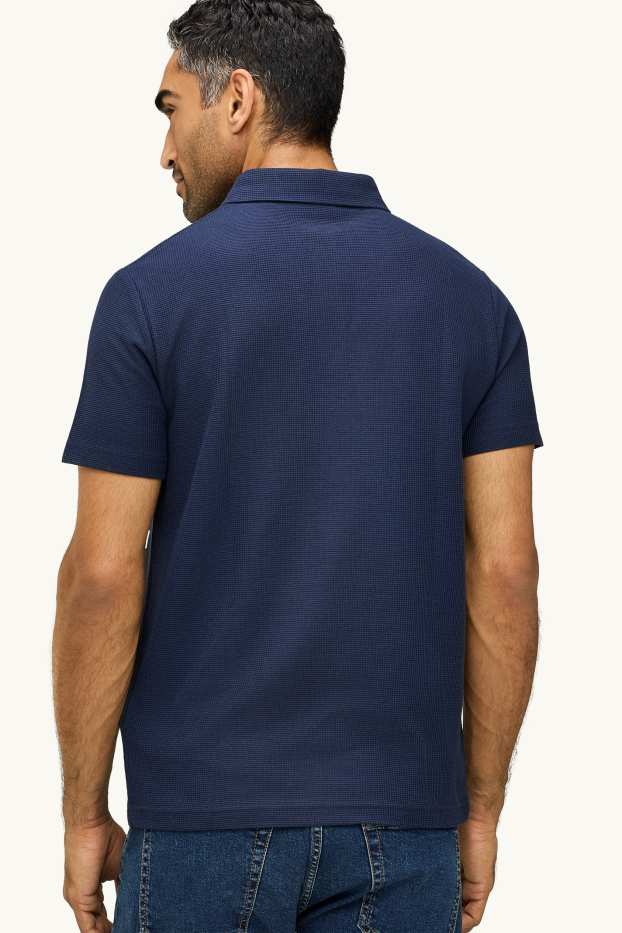Uomo - Polo - regular fit - tessuto tramato - blu scuro