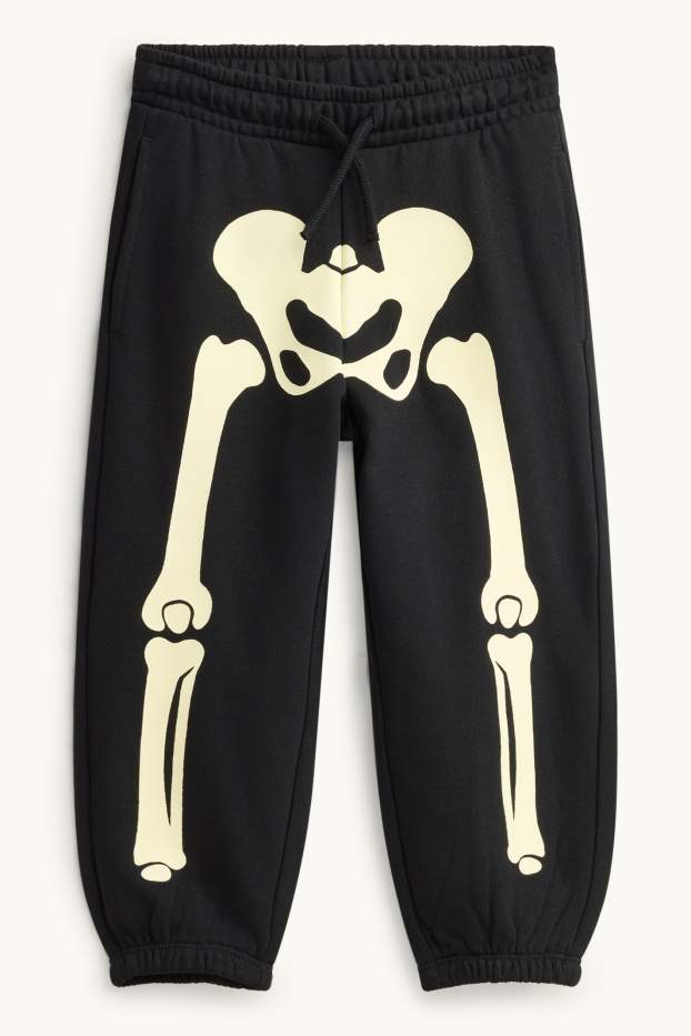 Nen - Halloween - esquelet - pantalons de xandall - brilla en la foscor - negre