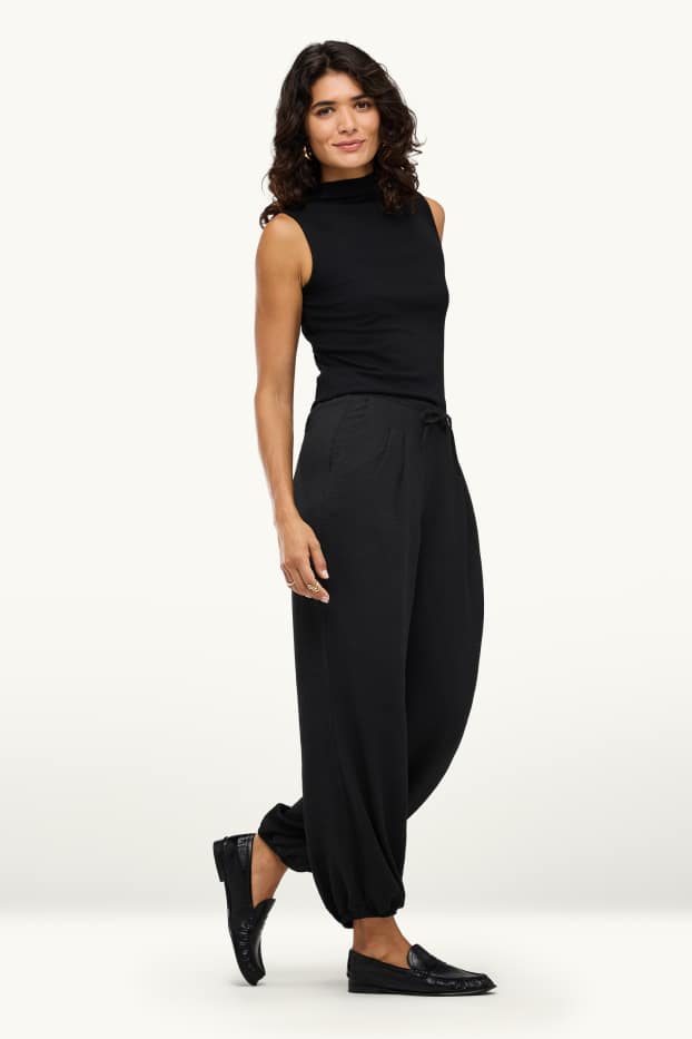 Women - Harem trousers - mid-rise waist - balloon leg - black