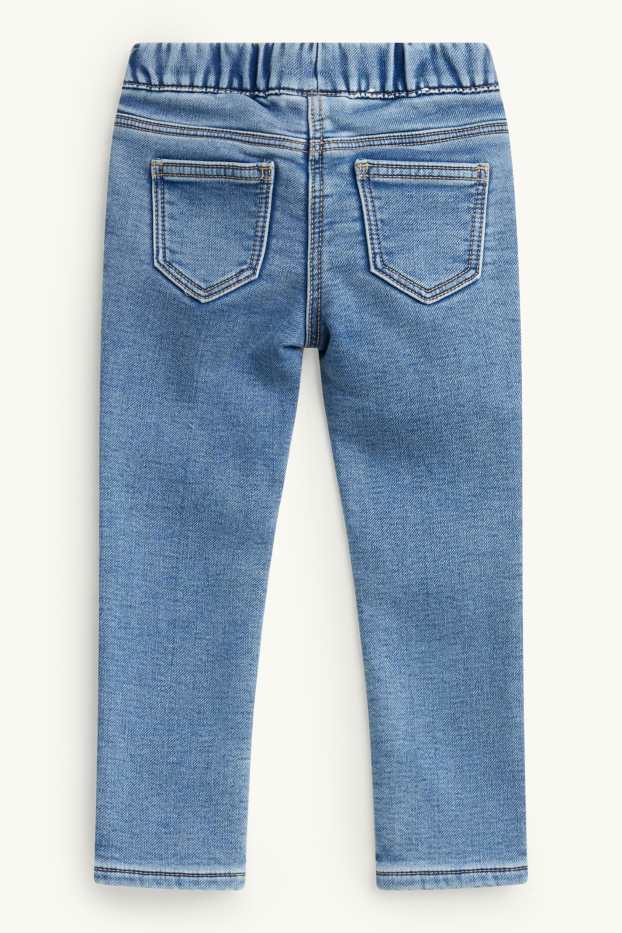 Kinderen: meisjes - Vlinder - jegging jeans - thermojegging - glanseffect - jeanslichtblauw