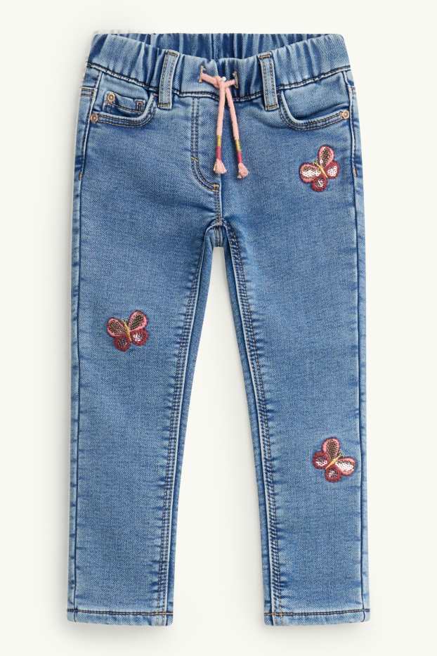 Kinderen: meisjes - Vlinder - jegging jeans - thermojegging - glanseffect - jeanslichtblauw