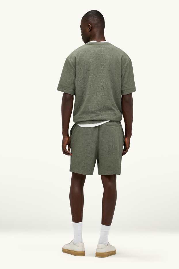 Hommes - Short en molleton - finition texturée - vert
