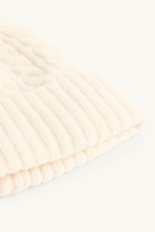 Kinderen: meisjes - Muts met pompon - kabelpatroon - crèmekleurig