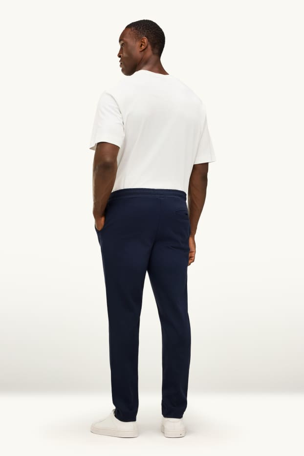 Uomo - Pantaloni sportivi - nero