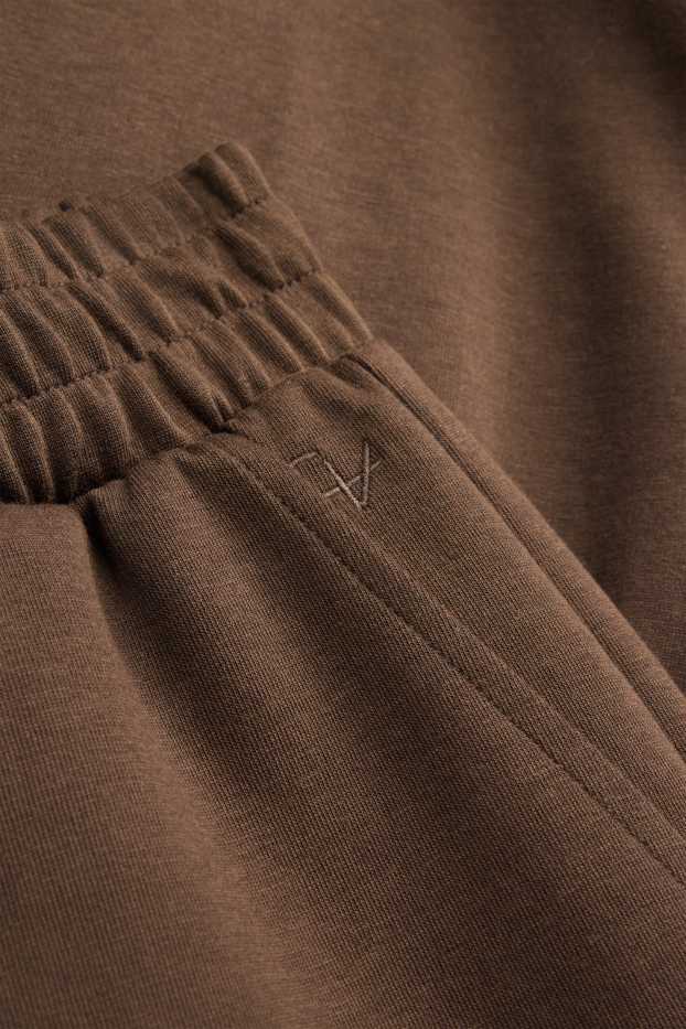 Uomo - Pantaloni sportivi - marrone scuro