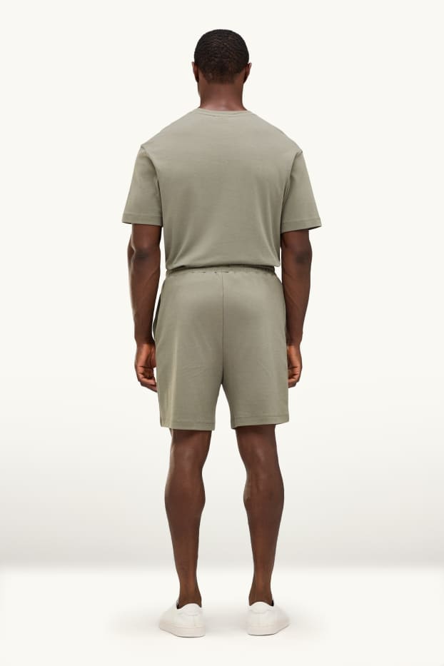 Bărbați - Pantaloni scurți de trening - verde deschis