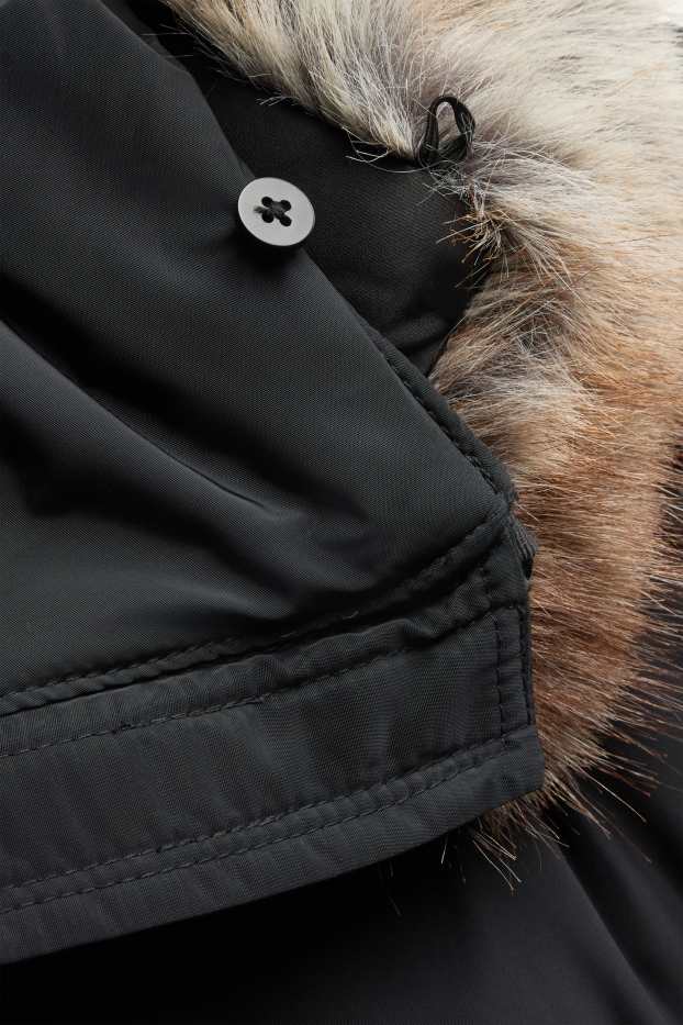 Femmes - Doudoune avec ceinture et capuche - finition déperlante - noir