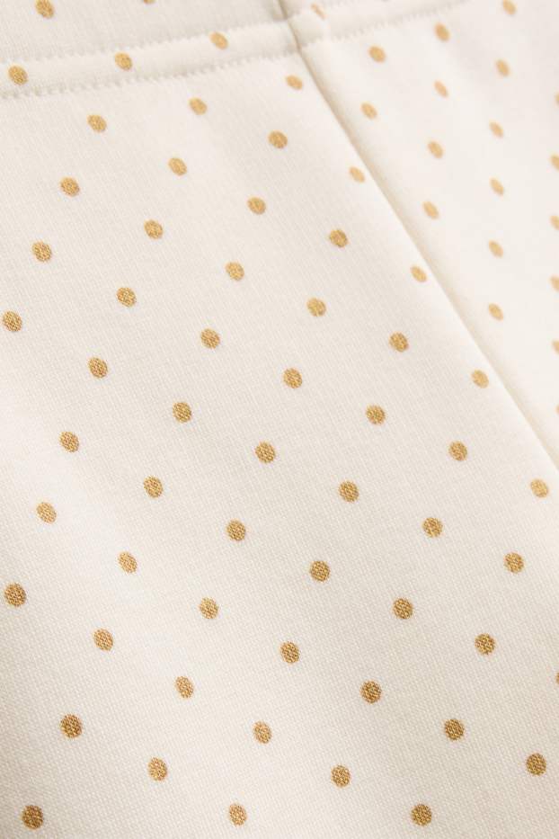 Baby: meisjes - Babylegging - gevoerd met pluche - gestippeld - crèmekleurig
